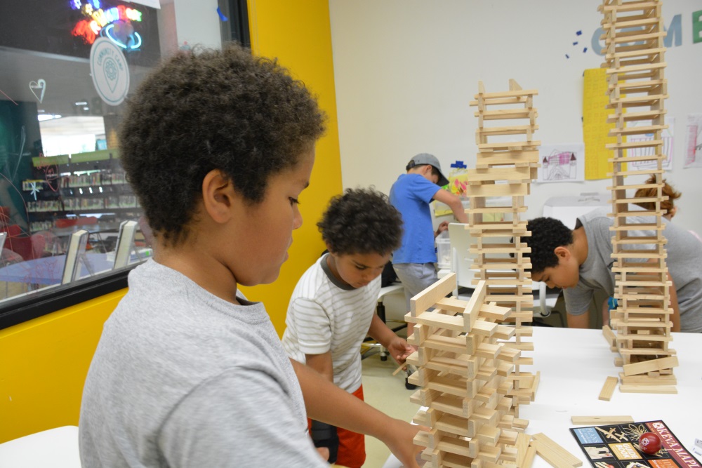 Kids building with KEVA planks